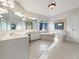 Bright bathroom featuring a jacuzzi tub, double vanity and large mirror, and great natural light at 2123 Tigger Ne Trce, Marietta, GA 30066