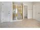 Bathroom featuring glass shower, tiled floors, and doorway leading to toilet at 2123 Tigger Ne Trce, Marietta, GA 30066