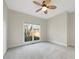 Bedroom with plush carpet, ceiling fan, and natural light at 2123 Tigger Ne Trce, Marietta, GA 30066