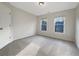 Bedroom featuring neutral paint, plush carpet, and great natural light from the windows at 2123 Tigger Ne Trce, Marietta, GA 30066