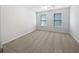 Bedroom with carpet, neutral paint, and two windows for natural light at 2123 Tigger Ne Trce, Marietta, GA 30066