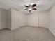 Spacious bedroom showcasing neutral carpeting, ceiling fan, and three doors for closets and entry at 2123 Tigger Ne Trce, Marietta, GA 30066