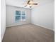 Clean and simple bedroom with carpet and a window providing natural light at 2123 Tigger Ne Trce, Marietta, GA 30066