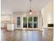 Open dining area with hardwood floors, seamlessly connected to a modern kitchen and bright living space at 2123 Tigger Ne Trce, Marietta, GA 30066