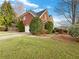 Charming brick home with an attached garage and manicured landscaping at 2123 Tigger Ne Trce, Marietta, GA 30066
