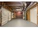 Unfinished garage with open rafters, shelving, and water heater at 2123 Tigger Ne Trce, Marietta, GA 30066