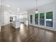 Bright kitchen featuring an island, hardwood floors, and stainless steel appliances at 2123 Tigger Ne Trce, Marietta, GA 30066