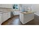 Modern kitchen with stainless steel appliances, hardwood floors and a large island with countertop dining at 2123 Tigger Ne Trce, Marietta, GA 30066