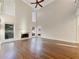 Bright living room featuring tall ceilings, hardwood flooring, and a cozy fireplace at 2123 Tigger Ne Trce, Marietta, GA 30066