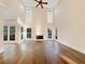 Bright living room with hardwood floors, fireplace, high ceilings, and ample windows at 2123 Tigger Ne Trce, Marietta, GA 30066