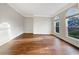 Well-lit living room with hardwood floors, bright walls, and large windows at 2123 Tigger Ne Trce, Marietta, GA 30066
