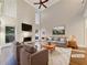 Bright living room with high ceilings, fireplace, and picture windows, virtually staged for modern living at 2123 Tigger Ne Trce, Marietta, GA 30066
