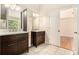 Bathroom features a dual sink vanity with marble counters and hardwood cabinets at 3707 Mcguire Nw St, Kennesaw, GA 30144