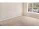 Carpeted bedroom with a large window view of the outdoors at 3707 Mcguire Nw St, Kennesaw, GA 30144