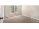 Bright bedroom featuring neutral carpeting and a window offering an abundance of natural light at 3707 Mcguire Nw St, Kennesaw, GA 30144