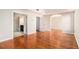 Large primary bedroom featuring beautiful floors, archway, and ensuite bathroom at 3707 Mcguire Nw St, Kennesaw, GA 30144