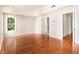 Primary bedroom with hardwood floors, a tray ceiling and ensuite bath access at 3707 Mcguire Nw St, Kennesaw, GA 30144