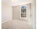 Bedroom featuring natural light, neutral carpet, and a closet at 3707 Mcguire Nw St, Kennesaw, GA 30144