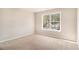 Cozy bedroom with large window and soft carpet is perfect for relaxing at 3707 Mcguire Nw St, Kennesaw, GA 30144