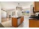 Open kitchen area featuring stainless steel appliances and a view of the living room fireplace at 3707 Mcguire Nw St, Kennesaw, GA 30144