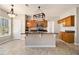 Bright eat-in kitchen boasting tile flooring, granite countertops, and stainless-steel appliances at 3707 Mcguire Nw St, Kennesaw, GA 30144