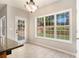 Bright kitchen nook with large windows and French door access to the backyard at 3707 Mcguire Nw St, Kennesaw, GA 30144