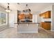 Stylish kitchen featuring granite countertops, wooden cabinets, and a center island at 3707 Mcguire Nw St, Kennesaw, GA 30144