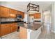 Well-lit kitchen features stainless-steel appliances, granite countertops, and custom cabinetry at 3707 Mcguire Nw St, Kennesaw, GA 30144