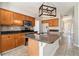 Stylish kitchen featuring granite countertops, wooden cabinets, and a center island at 3707 Mcguire Nw St, Kennesaw, GA 30144