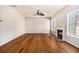 Spacious living room with hardwood floors and fireplace offers ample space for living at 3707 Mcguire Nw St, Kennesaw, GA 30144