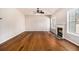 Spacious living room with gleaming hardwood floors and cozy fireplace at 3707 Mcguire Nw St, Kennesaw, GA 30144