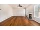 Bright living room featuring hardwood floors and a fireplace with beautiful natural light at 3707 Mcguire Nw St, Kennesaw, GA 30144