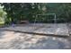 Community playground with swings, spring riders, and seating area at 3707 Mcguire Nw St, Kennesaw, GA 30144