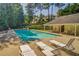 Community pool featuring ample lounge seating and a covered pavilion at 3707 Mcguire Nw St, Kennesaw, GA 30144