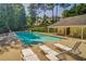 Community pool with lounge chairs and shade provides a resort-like experience at 3707 Mcguire Nw St, Kennesaw, GA 30144