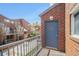 Outdoor balcony with brick facade, railings, and a blue door for private access at 377 Ralph Mcgill Ne Blvd # H, Atlanta, GA 30312