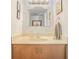 Bathroom vanity with a decorative mirror, light fixture, and neutral-toned countertop at 377 Ralph Mcgill Ne Blvd # H, Atlanta, GA 30312