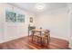 Bright dining room with hardwood floors and a classic table and chairs set at 377 Ralph Mcgill Ne Blvd # H, Atlanta, GA 30312