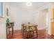 Bright dining room with hardwood floors and a classic table and chairs set at 377 Ralph Mcgill Ne Blvd # H, Atlanta, GA 30312