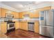 Modern kitchen featuring stainless steel appliances and warm wood cabinets at 377 Ralph Mcgill Ne Blvd # H, Atlanta, GA 30312