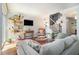 Stylish living room with hardwood floors, ample seating, and modern shelving at 377 Ralph Mcgill Ne Blvd # H, Atlanta, GA 30312