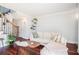 Cozy living room with hardwood floors, neutral decor, and a staircase at 377 Ralph Mcgill Ne Blvd # H, Atlanta, GA 30312