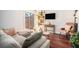 Bright and airy living room featuring hardwood floors and a comfortable sofa at 377 Ralph Mcgill Ne Blvd # H, Atlanta, GA 30312