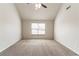 Spacious bedroom with carpeted floors, a ceiling fan, and ample natural light at 4097 Rosebud Park Dr, Snellville, GA 30039