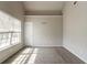 A bedroom with carpet flooring, light gray walls and a large window at 4097 Rosebud Park Dr, Snellville, GA 30039