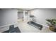 Spacious basement featuring home gym with modern treadmill and bench at 468 Windol Ct, Marietta, GA 30066