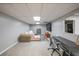 Spacious basement with a seating area, workspace, and entertainment center at 468 Windol Ct, Marietta, GA 30066