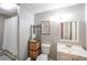Well-lit bathroom featuring a mirror, vanity and adjacent shower at 468 Windol Ct, Marietta, GA 30066