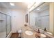 Clean bathroom featuring a granite countertop, glass shower door, and tiled walls at 468 Windol Ct, Marietta, GA 30066