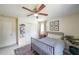 Cozy bedroom showcasing a ceiling fan, a comfortable bed, and a light-filled ambiance at 468 Windol Ct, Marietta, GA 30066